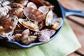 Cast iron skillet of Delicious Fresh Steamer Clams with Garlic a Royalty Free Stock Photo