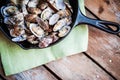 Cast iron skillet of Delicious Fresh Steamer Clams with Garlic a Royalty Free Stock Photo