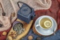 Still life with traditional sage tea prepared in vintage cast iron teapot on rustic wooden table. Retro filter Royalty Free Stock Photo