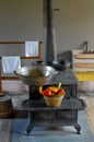 Cast Iron Wood Stove with Basket of Vegetables Royalty Free Stock Photo