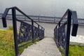 Cast iron wrought iron stairs in the city park. Iron railing , classic handrail Royalty Free Stock Photo