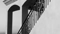 A cast ironl railing on a stair way in black and white. Royalty Free Stock Photo