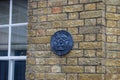 A cast lead plaque denoted a Listed Building