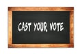 CAST YOUR VOTE text written on wooden frame school blackboard