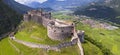 Castel Beseno aerial drone panoramic view - Most famous and impressive historical medieval castles of Italy in Trento Royalty Free Stock Photo