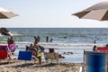 Beach seller with his goods on the beach of Castel Volturno in Italy