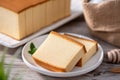 Castella kasutera - Delicious Japanese sliced sponge cake food on white plate over rustic wooden table, close up, healthy eating Royalty Free Stock Photo