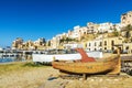 Old wooden fishing boat moored on the beach in Italy Royalty Free Stock Photo