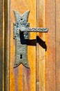 castellanza blur brown knocker in a door c wood italy cross Royalty Free Stock Photo