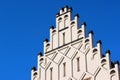 Castellation walls and turrets on a rooftop against the blue sky background Royalty Free Stock Photo