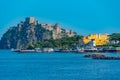 Castello Aragonese behind hotels of Italian island Ischia