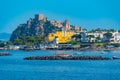 Castello Aragonese behind hotels of Italian island Ischia