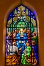 Adoration of Virgin Mary on stained glass window inside the cathedral of Castellon de la Plana, Spain