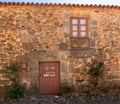 Tiny front door and window on ancient house in Castelo Rodrigo in Portugal
