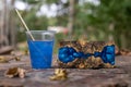 Casting blue epoxy resin burl wood cube on old table art background