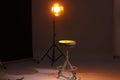 Casting call. Chair and lamp in modern studio Royalty Free Stock Photo