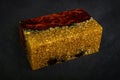 epoxy resin gold with nature burl BURMA PADAUK wood cube on black background Royalty Free Stock Photo