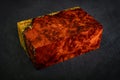 epoxy resin gold with nature burl BURMA PADAUK wood cube on black background Royalty Free Stock Photo