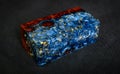 epoxy resin gold with nature burl BURMA PADAUK wood cube on black background Royalty Free Stock Photo