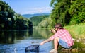 Casting off. mature bearded man with fish on rod. successful fisherman in lake. hipster fishing with spoon-bait. fly Royalty Free Stock Photo
