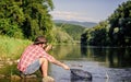 Casting off. mature bearded man with fish on rod. successful fisherman in lake. hipster fishing with spoon-bait. fly Royalty Free Stock Photo