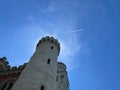 Castle with airplane contrail in background