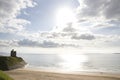 Castle and beach on a bright sunset evening Royalty Free Stock Photo