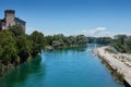 Castle of Cassano D`Adda, Italy, at the foot of the river with people taking sun