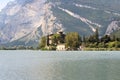 Castle Castel Toblino at lake Lago di Toblino and mountain panorama, Italy