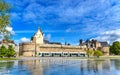 Castle of the Dukes of Brittany, a City tram and the Water Mirror fountain in Nantes, France