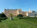 Castle garden Lednice in summer day with castle and greenhouse in background Royalty Free Stock Photo