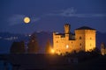 Castle of Grinzane Cavour in nocturnal with a full moon Royalty Free Stock Photo