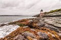Castle Hill Lighthouse in Newport, Rhode Island, situated on a dramatic rocky coastline Royalty Free Stock Photo