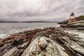 Castle Hill Lighthouse in Newport, Rhode Island, situated on a dramatic rocky coastline Royalty Free Stock Photo