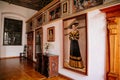 Castle interior, Baroque and renaissance furniture, golden hall, portrait of a lady, carved wooden chest of drawers and chair, Royalty Free Stock Photo