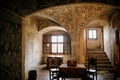 Castle interior, Baroque and renaissance furniture, painted ceiling with sgraffito, wooden carved armchairs and table, chateau