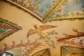 Castle interior, ceiling baroque stucco, bright frescoes, image of bird on branch, floral and natural ornaments, sculptures,