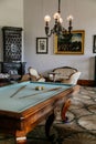 Castle interior. Men`s salon with ceramic stove and billiard table. Castle Kacina, Empire Chateau near Kutna Hora, Bohemia, Czech