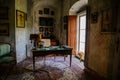 Castle interior. An office with a desk and an armchair. Antique lamp and telephone. Pictures and photos on the walls.  Jezeri, Royalty Free Stock Photo