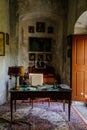 Castle interior. An office with a desk and an armchair. Antique lamp and telephone. Pictures and photos on the walls.  Jezeri, Royalty Free Stock Photo