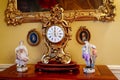 Castle interior. Porcelain figurines and antique clock. Renaissance castle Horsovsky Tyn, Czech Republic Royalty Free Stock Photo