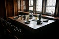 Castle interior, Retro style dining room with baroque and renaissance furniture, Wine glasses set up on the table with vintage