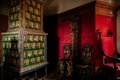 Castle interior, Retro style room with baroque and renaissance furniture and old antique green ceramic tiled stove, red velvet,