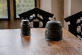 Castle interior. Vintage medieval cups standing on a wooden table. Medieval castle Rozmberk nad Vltavou, South Bohemia, Czech