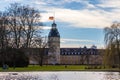 Castle Karlsruhe with Garden and Pond, and Flag and Halfmast, inside green Nature. District Karlsruhe, Baden-WÃÂ¼rttemberg, Germany