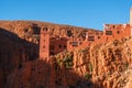 Castle kasbah hotel on the high Cliff in amazing place at Picturesque Serpentine mountain road in Gorges Dades in high Royalty Free Stock Photo