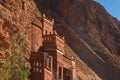 Castle kasbah hotel on the high Cliff in amazing place at Picturesque Serpentine mountain road in Gorges Dades in high Royalty Free Stock Photo