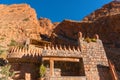 Castle kasbah hotel on the high Cliff in amazing place at Picturesque Serpentine mountain road in Gorges Dades in high Royalty Free Stock Photo