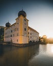 Castle Kottingbrunn during summer with the reflecting lake