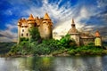 castle on lake over sunset